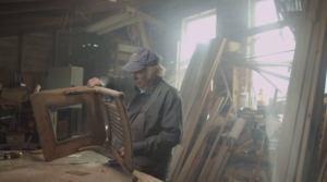 Man working on wooden chair