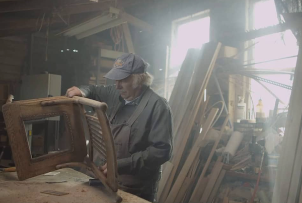 Man working on wooden chair