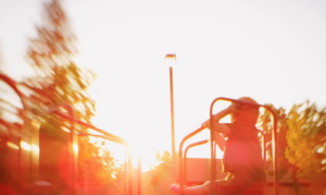 Child playing at sunset