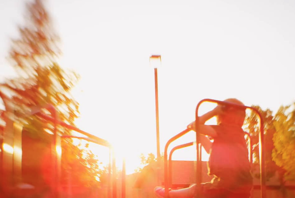 Child playing at sunset