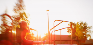 Child playing at sunset