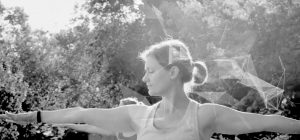 Close-up of woman doing yoga with graphic overlay
