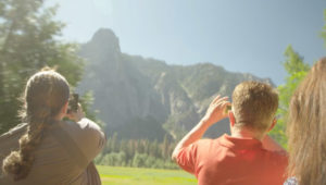 Couple taking pictures of mountain