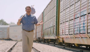 Spokesman walking along railroad tracks