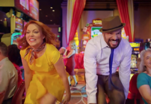 A man and a woman dancing in a casino
