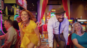 A man and a woman dancing in a casino
