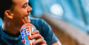 A man drinking an ICEE