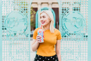 A woman drinking an ICEE