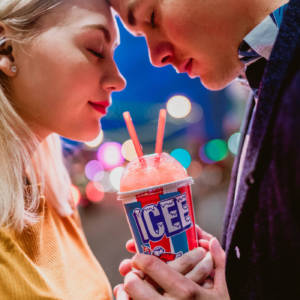 A man and a woman drinking ICEEs