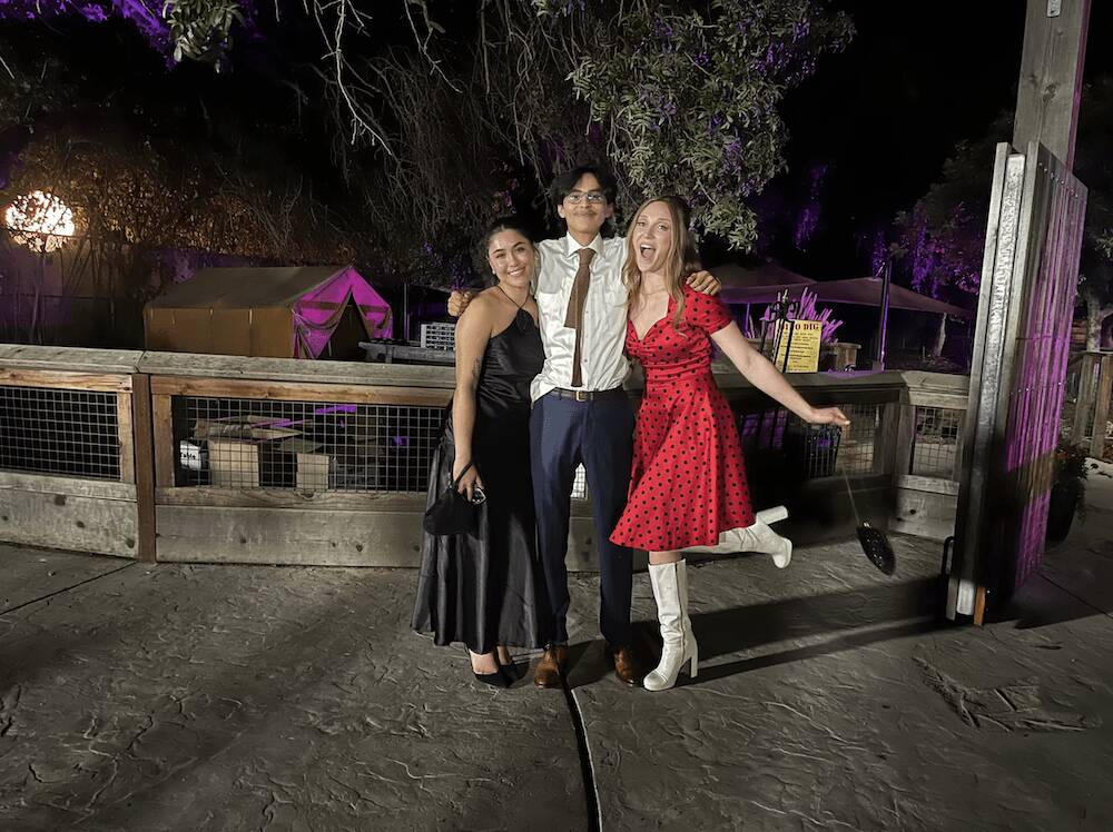 Jordan with fellow coworkers at an outdoor evening event, reflecting her vibrant personality and collaboration skills essential for video production.