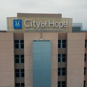 City of Hope Helford Clinical Research Hospital building exterior with signage, a leading medical and cancer research center.